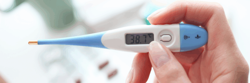 Digital thermometer showing a high temperature, indicating a fever.